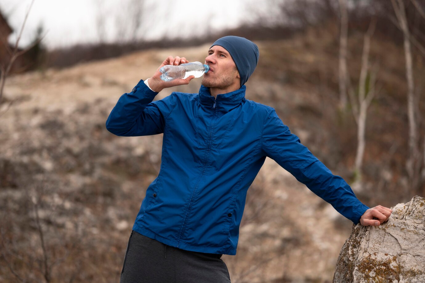 mid-shot-man-drinking-water-nature_23-2148776318.jpg